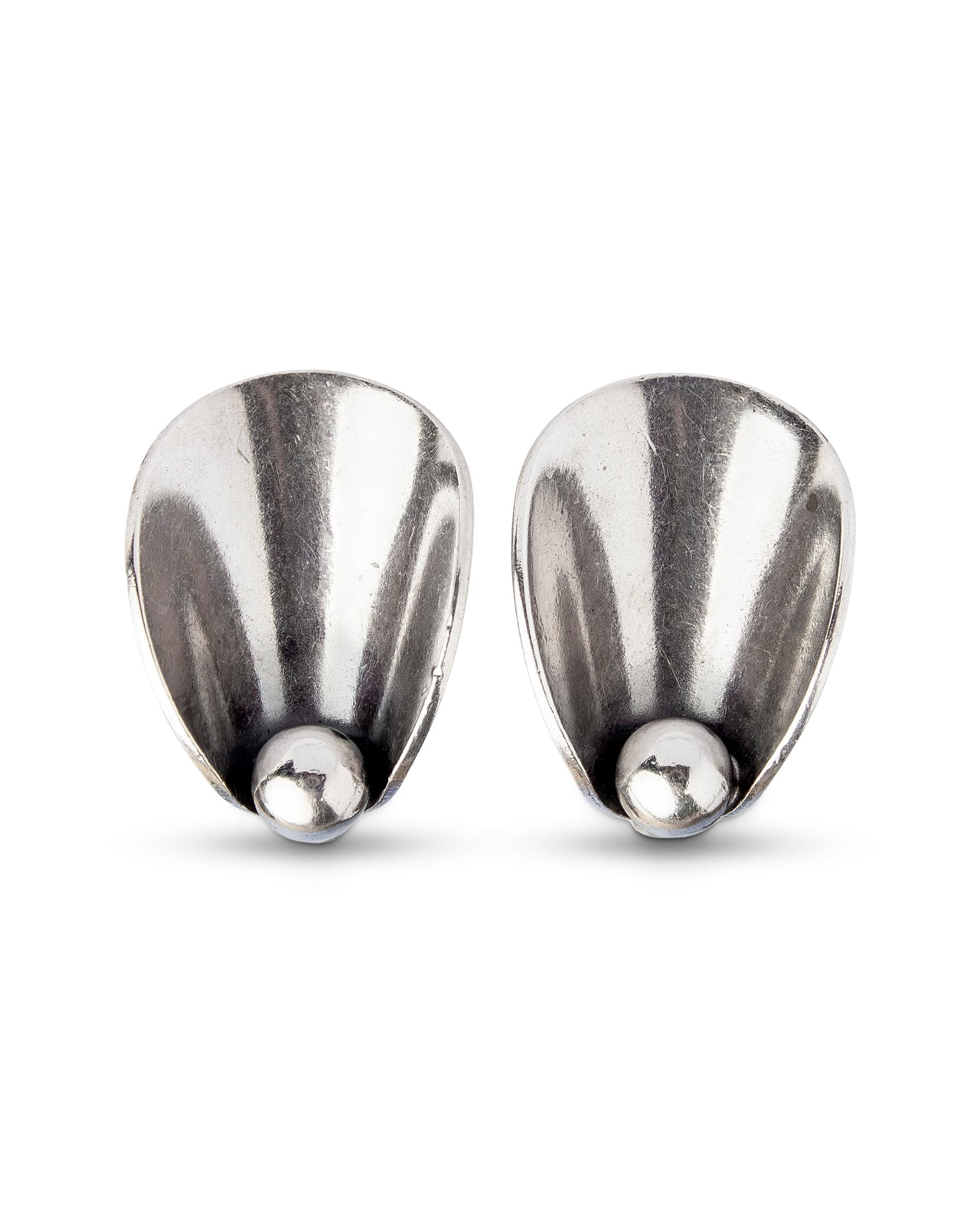 Niels Erik From, Sterling Silver Earrings, Denmark. Dating to the mid-century, these clip-on earrings are of stylised leaf form with a single ball terminal.