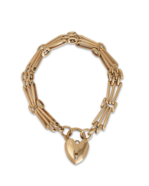 A vintage 9ct yellow gold gate-link bracelet with a heart-shaped padlock.