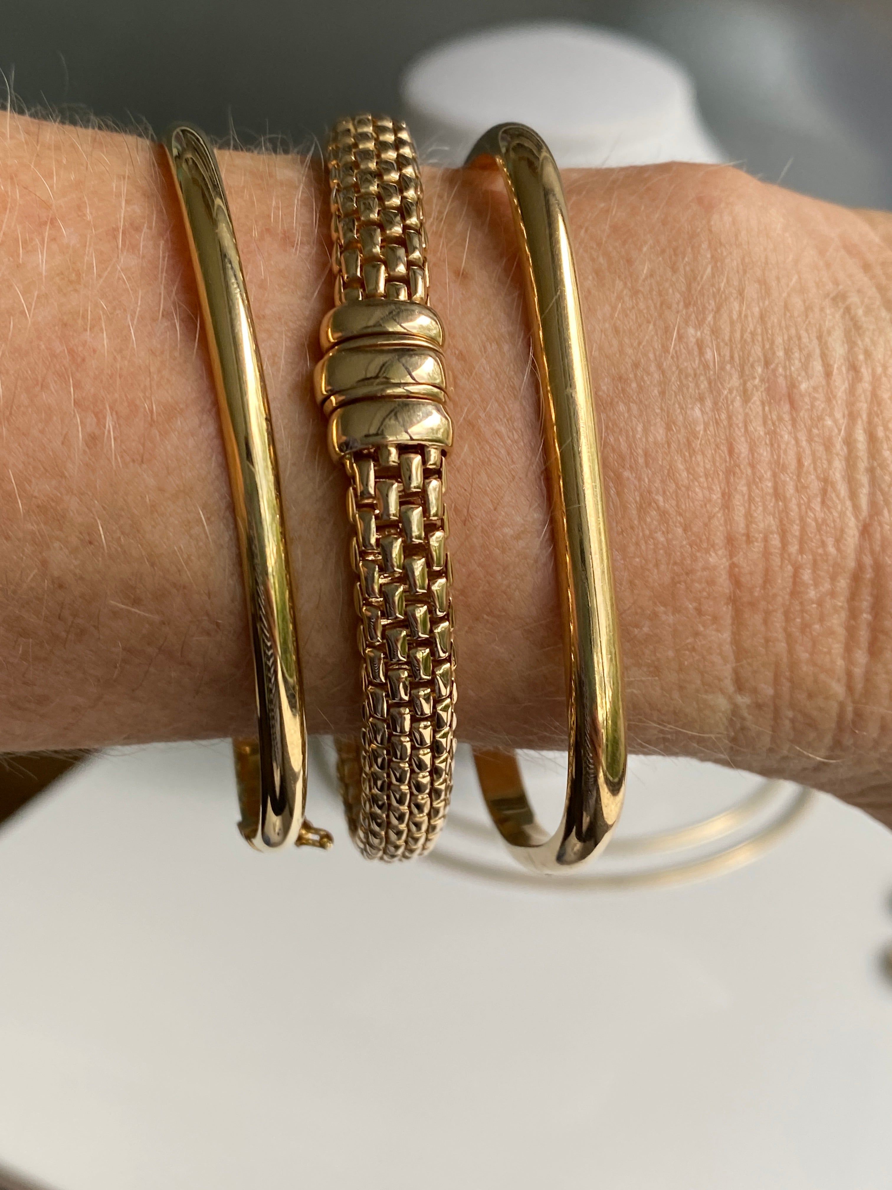 Three gold bangles