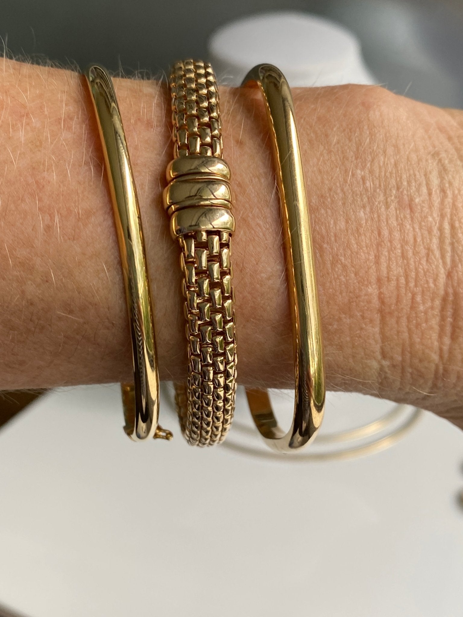 Three gold bangles