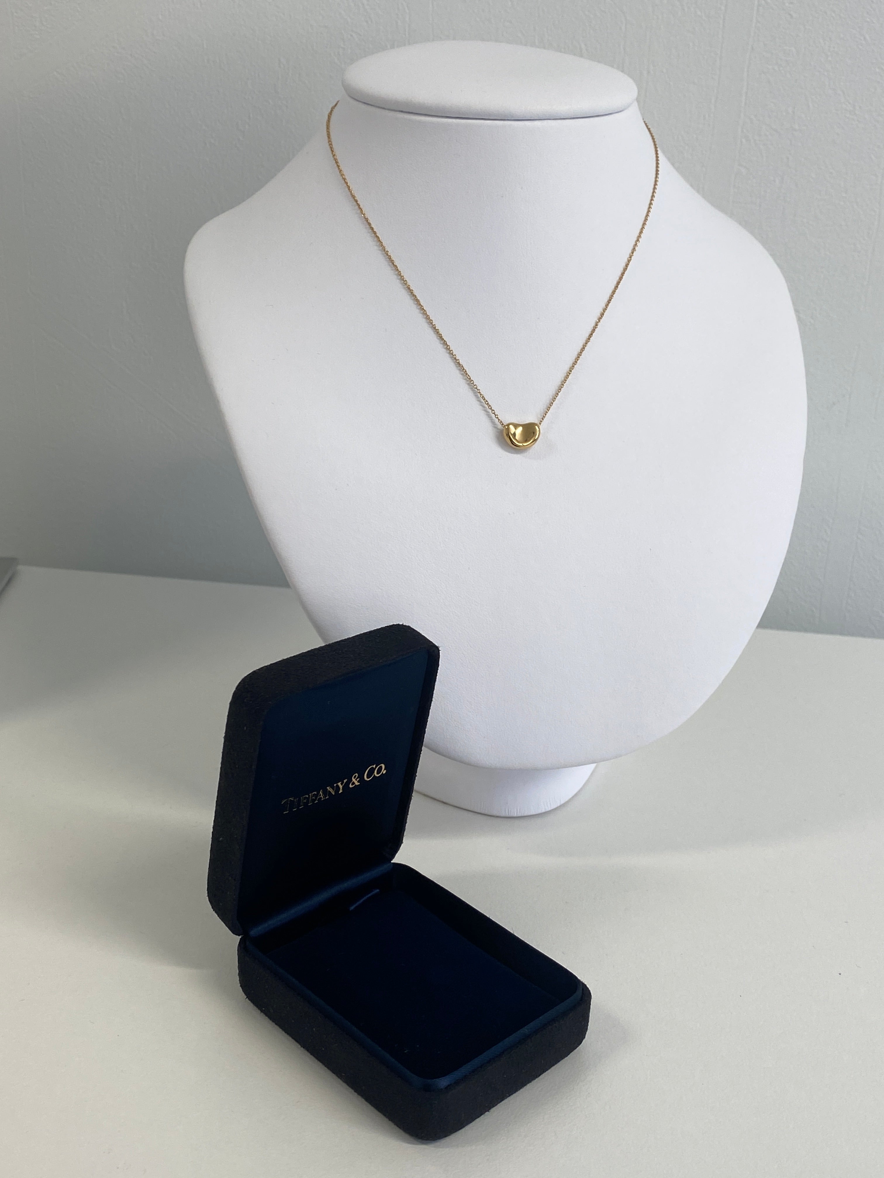 TIFFANY & CO. Gold Bean Pendant Necklace, designed by Elsa Peretti.