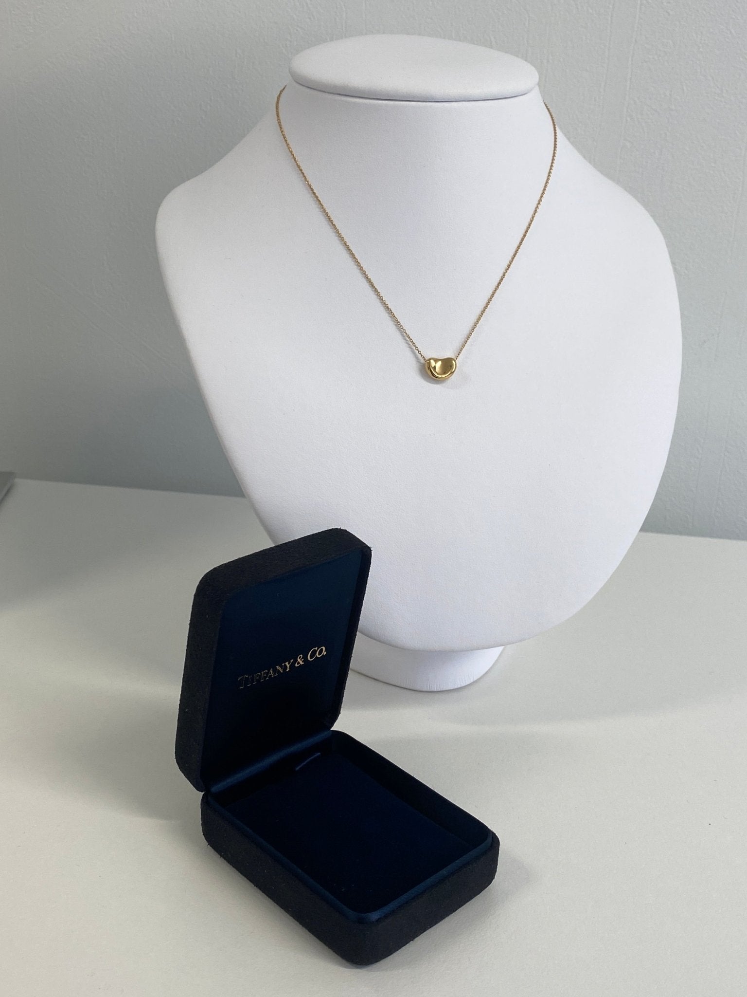 TIFFANY & CO. Gold Bean Pendant Necklace, designed by Elsa Peretti.