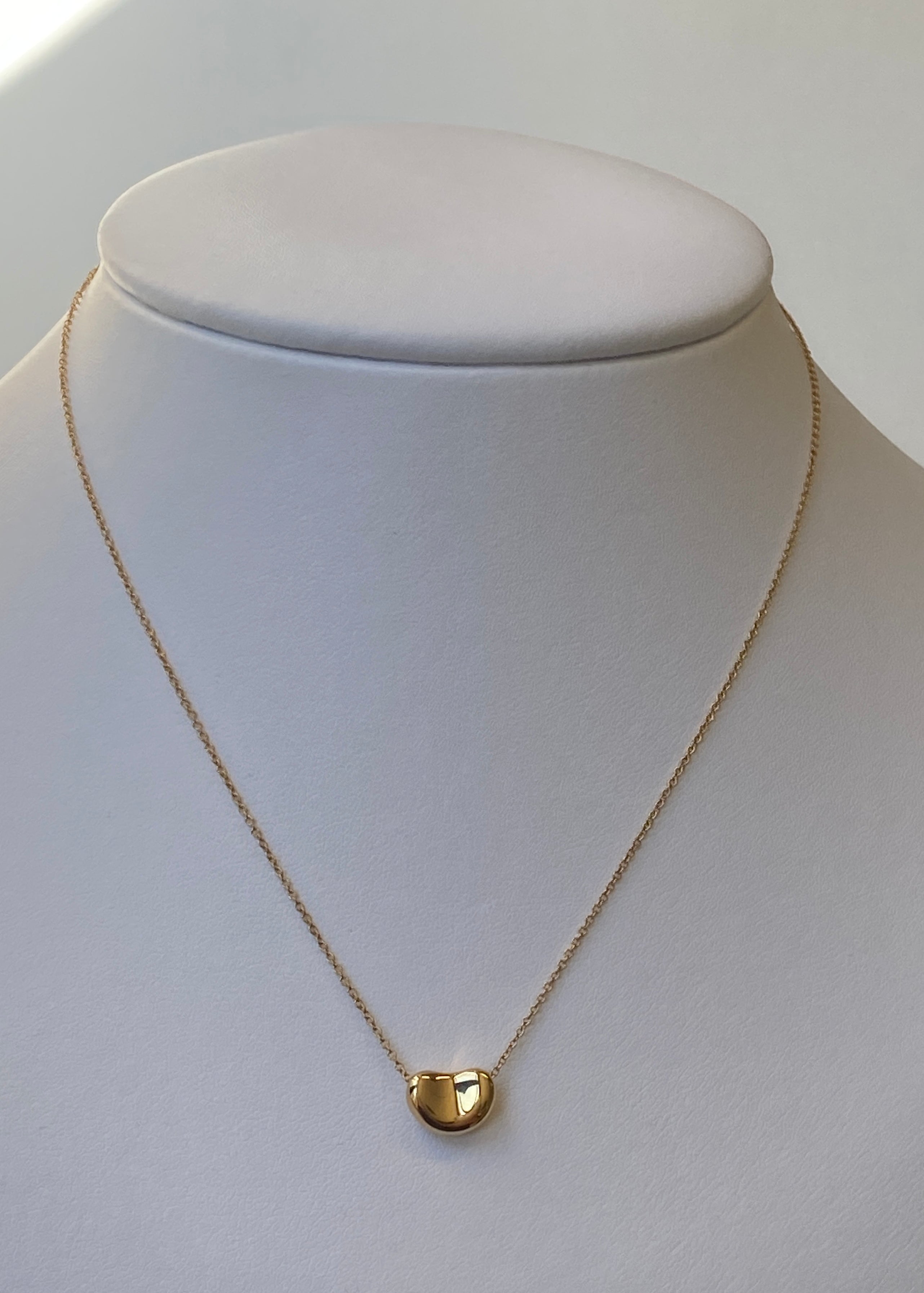 TIFFANY & CO. Gold Bean Pendant Necklace, designed by Elsa Peretti.