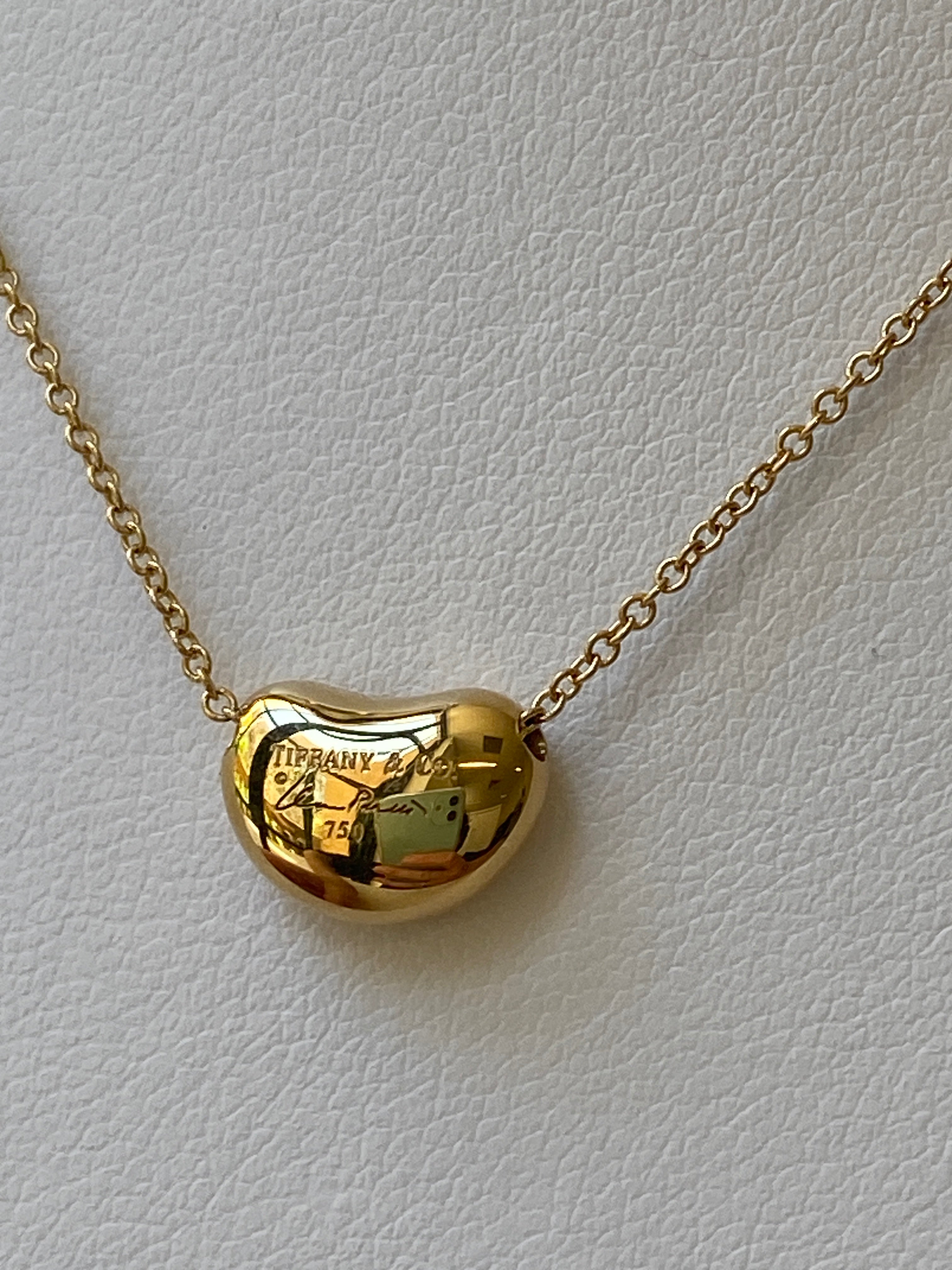 TIFFANY & CO. Gold Bean Pendant Necklace, designed by Elsa Peretti.