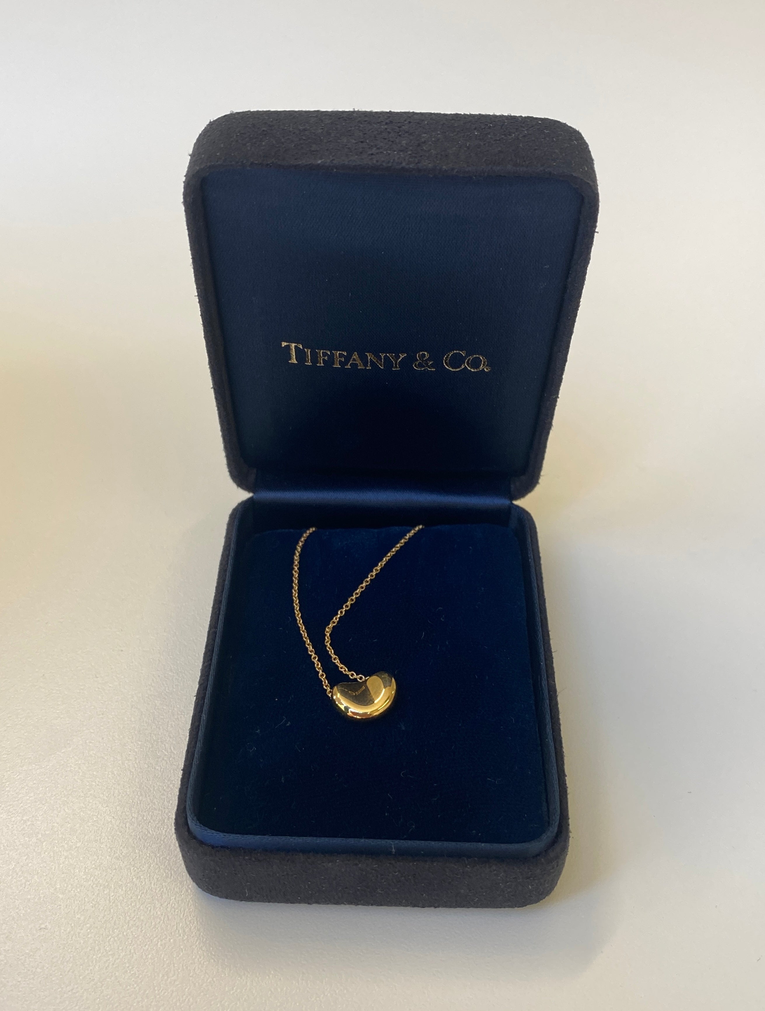TIFFANY & CO. Gold Bean Pendant Necklace, designed by Elsa Peretti.