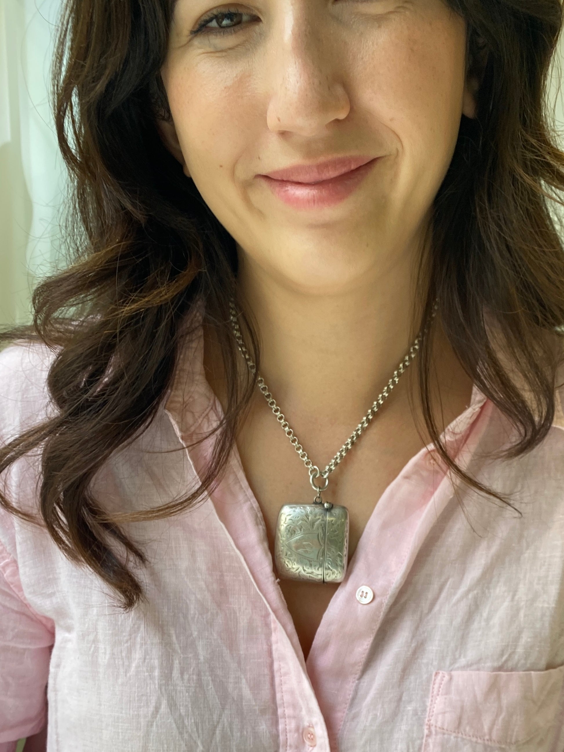 Antique Silver Vesta, Birmingham 1900, of rectangular bulbous form with hand engraved foliate decoration and a shield shaped cartouche bearing the initials S.A
