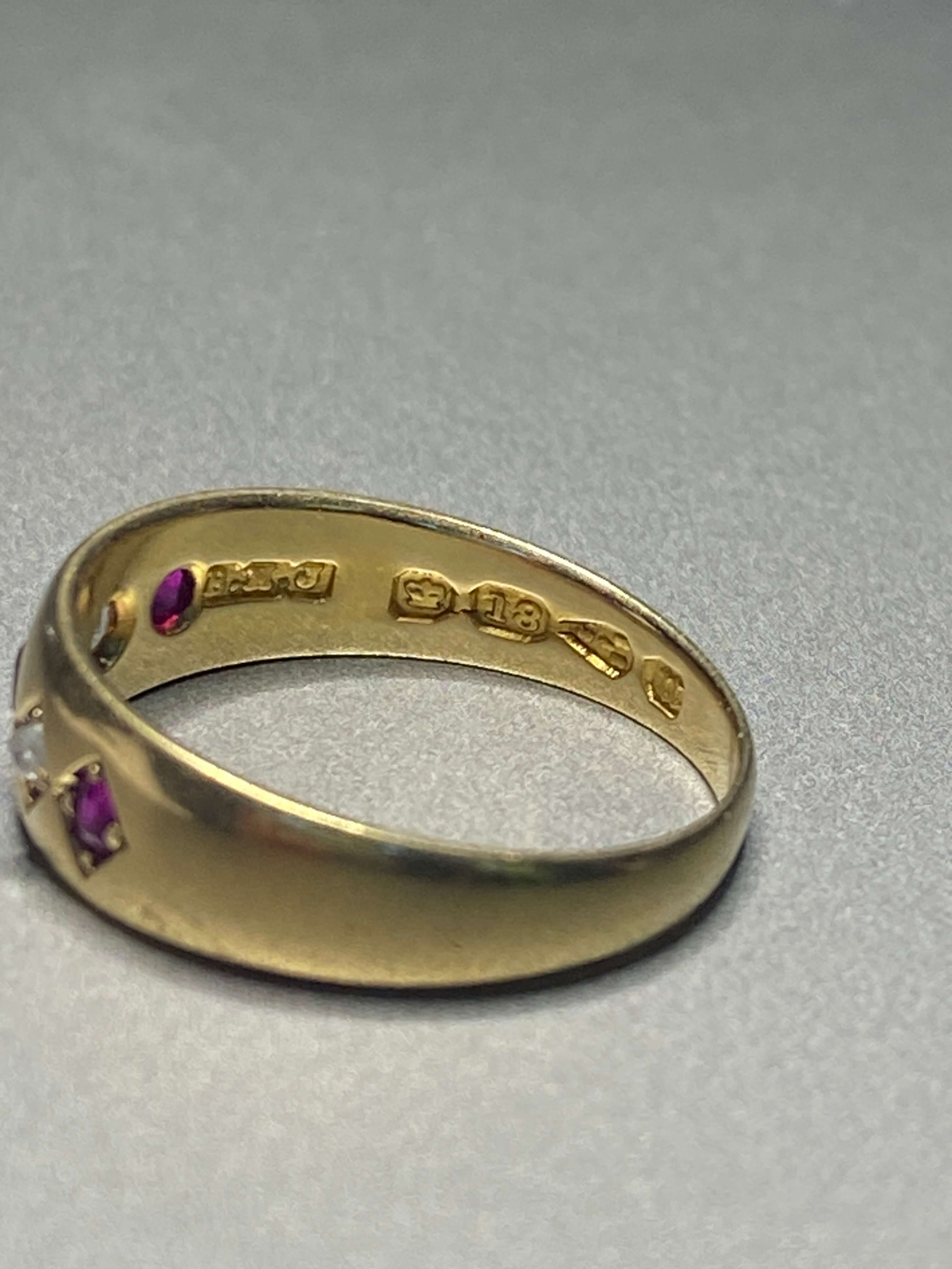 Antique Ruby & Diamond Gypsy Ring. A traditional late Victorian gypsy ring, flush set with three graduated rubies alternating with two old cut diamonds. 18ct yellow gold.