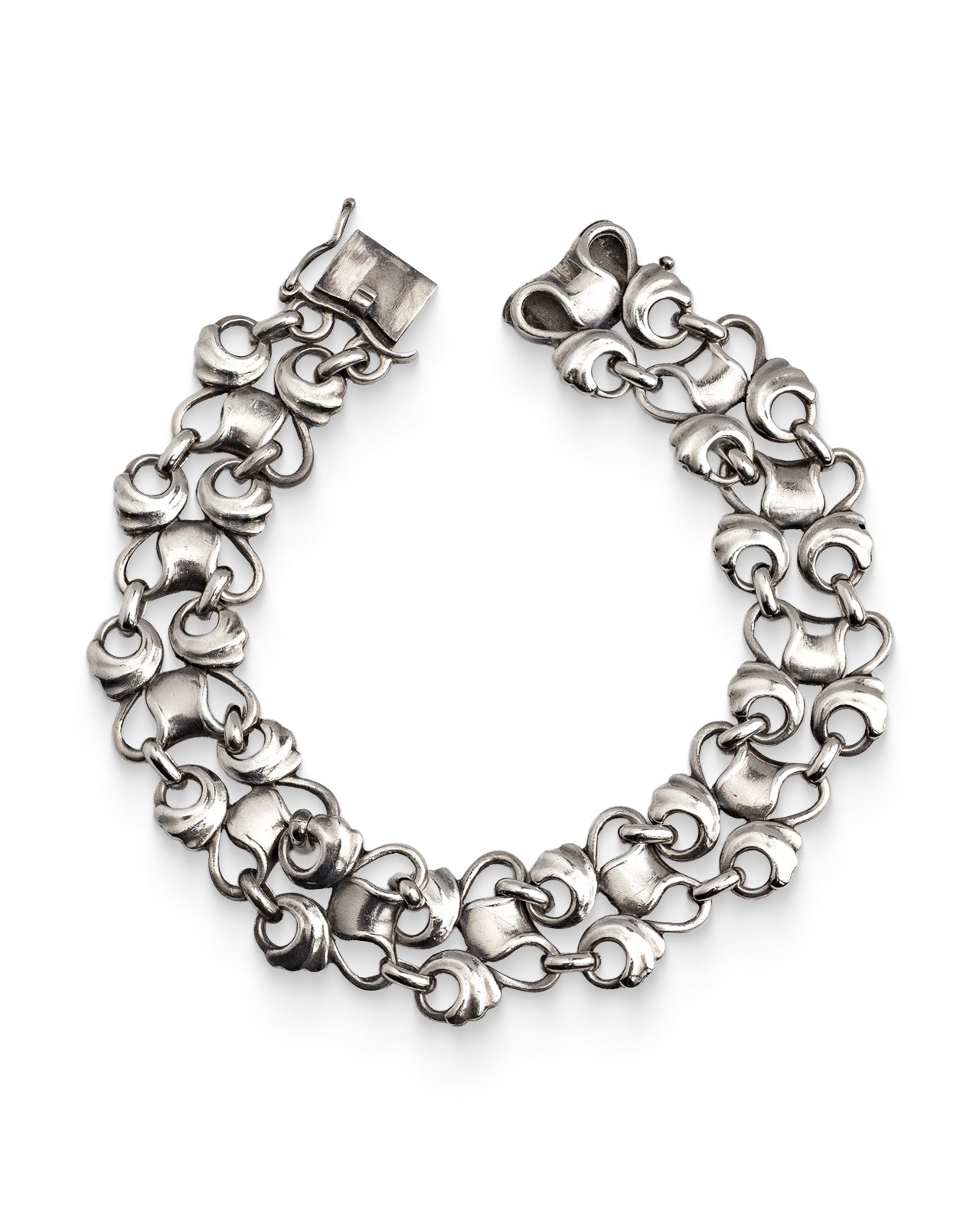 Authentic Georg Jensen, Vintage Silver Bracelet, No. 79, designed as a series of interlocking scrolling motifs.