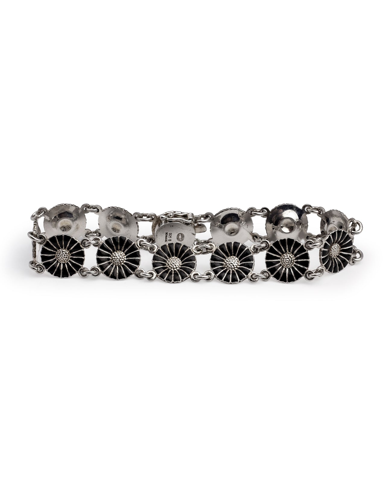 eorg Jensen, Silver & Enamel Daisy Bracelet from the iconic Daisy collection, featuring six round floral links with black enamel petals radiating from a domed, textured silver centre.