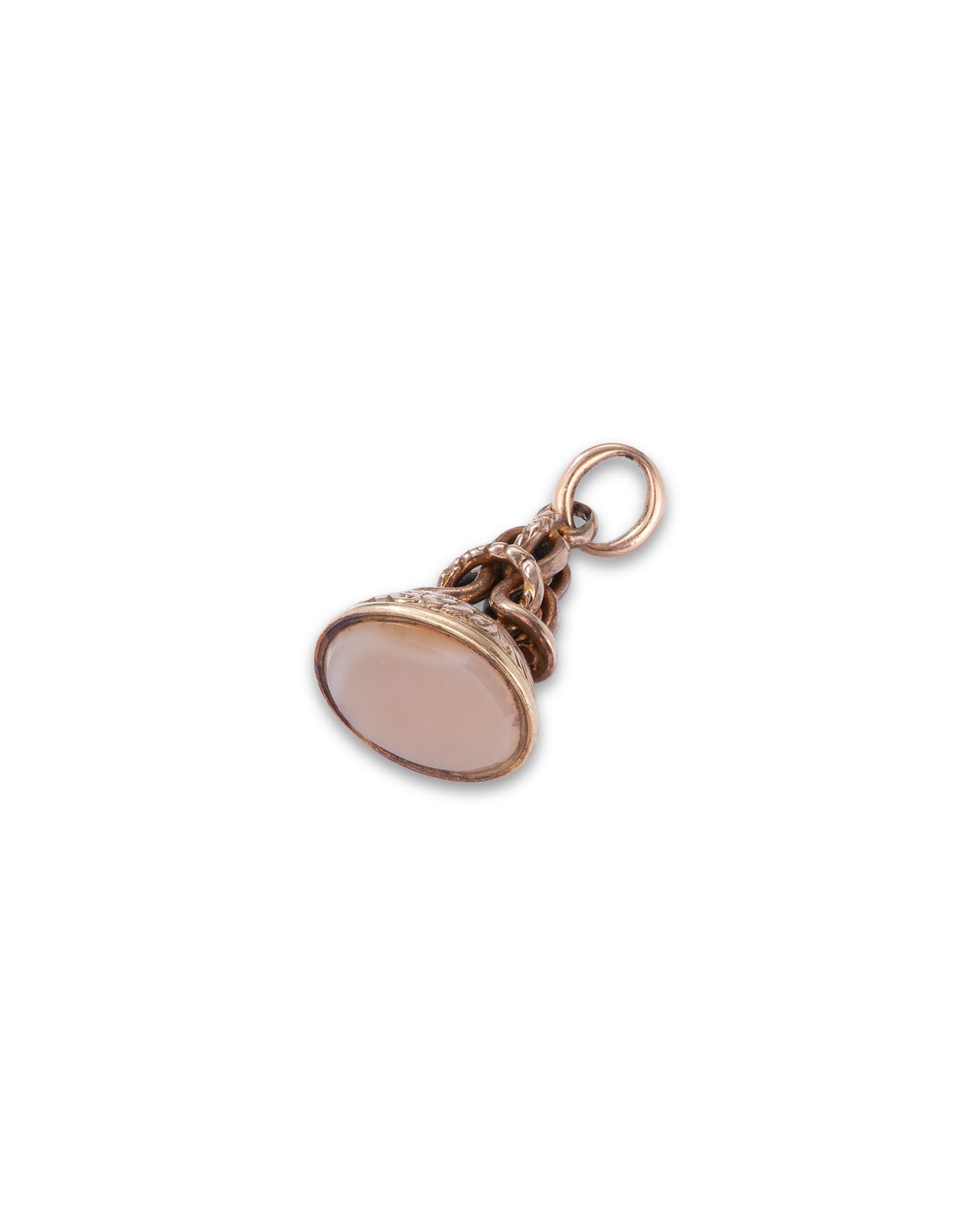 A small yellow gold pendant charm featuring an oval pale pink stone in a detailed filigree setting, complete with a top loop, shown on a plain white background.