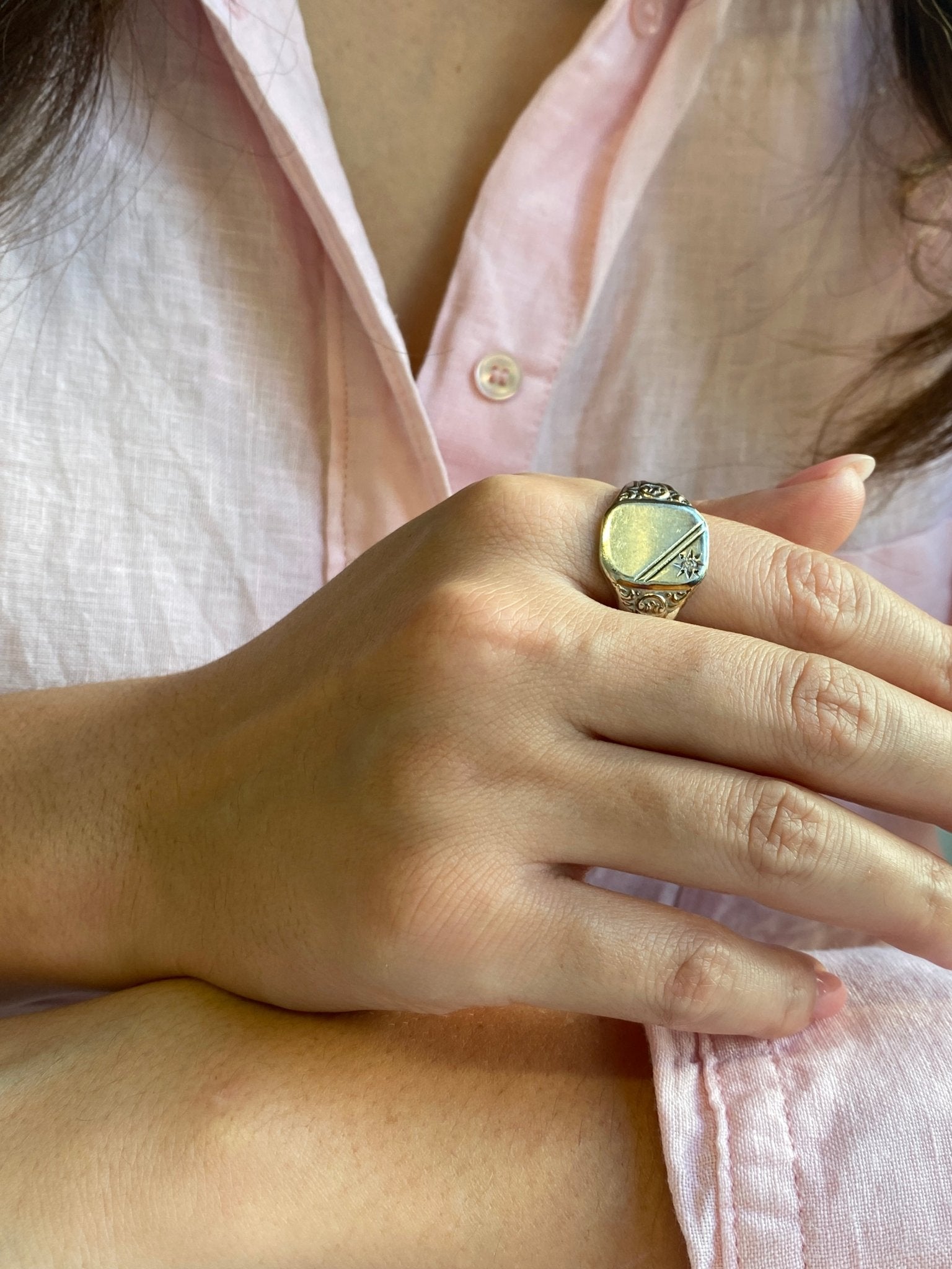 Vintage Silver Signet Ring. A classic signet ring set with a modern round brilliant cut diamond of estimated weight 0.03 carat.
