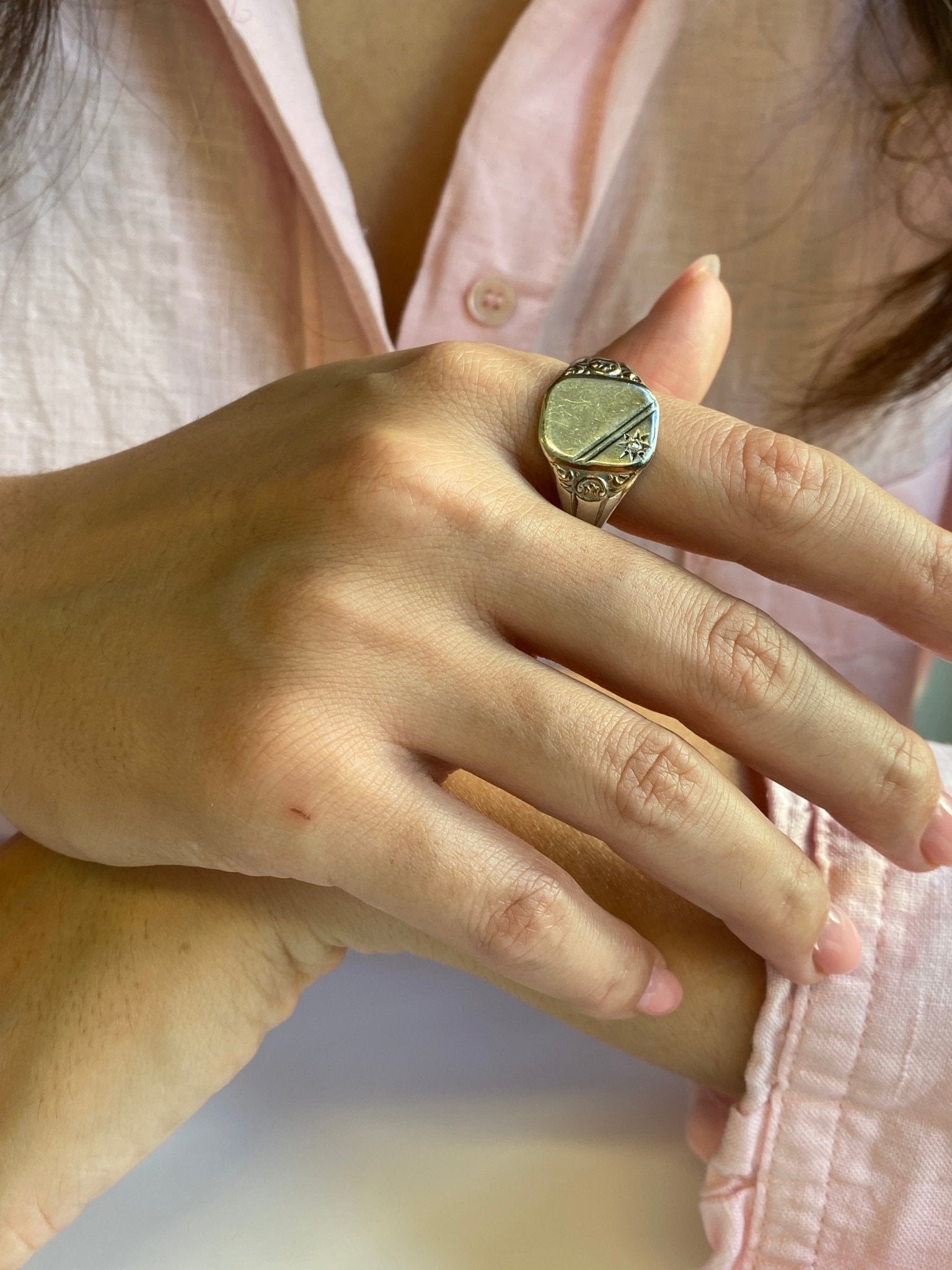 Vintage Silver Signet Ring. A classic signet ring set with a modern round brilliant cut diamond of estimated weight 0.03 carat.
