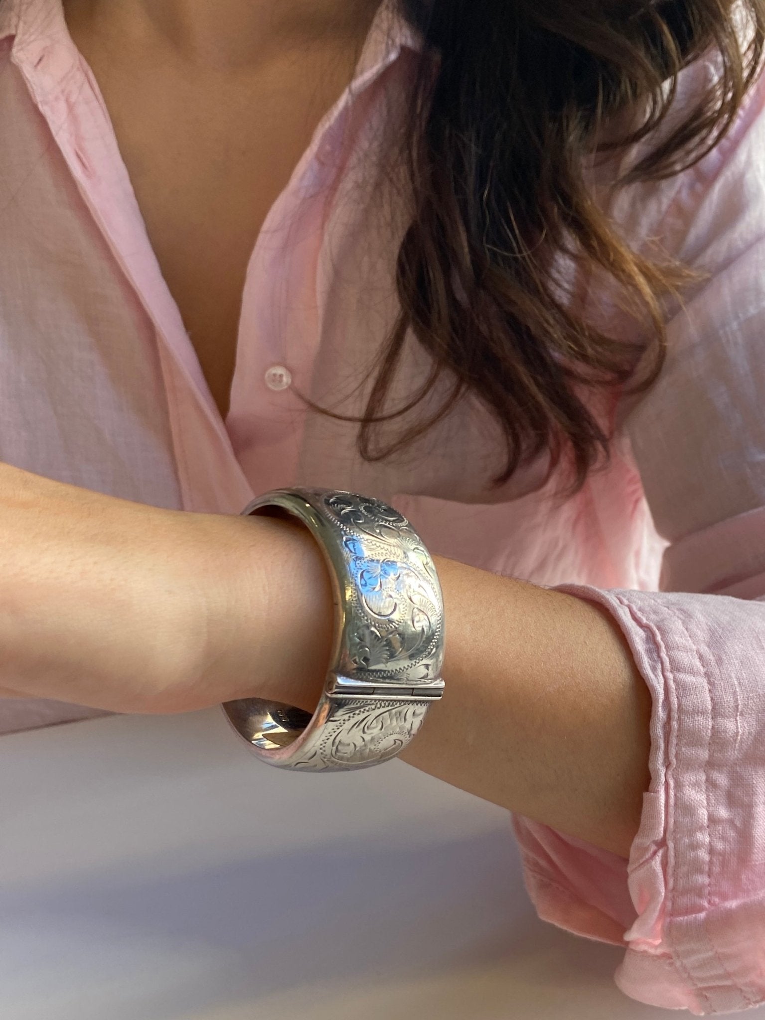 Vintage English Sterling Silver Bangle, c1970. The hinged bangle with all over engraved foliate decoration
