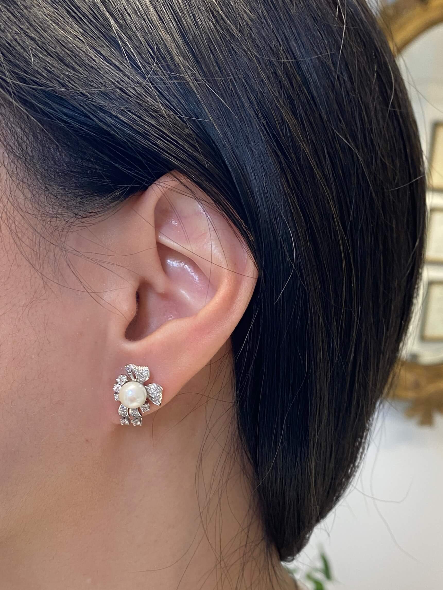 An elegant pair of 18ct white gold Diamond and Pearl Earrings from the 1950's.