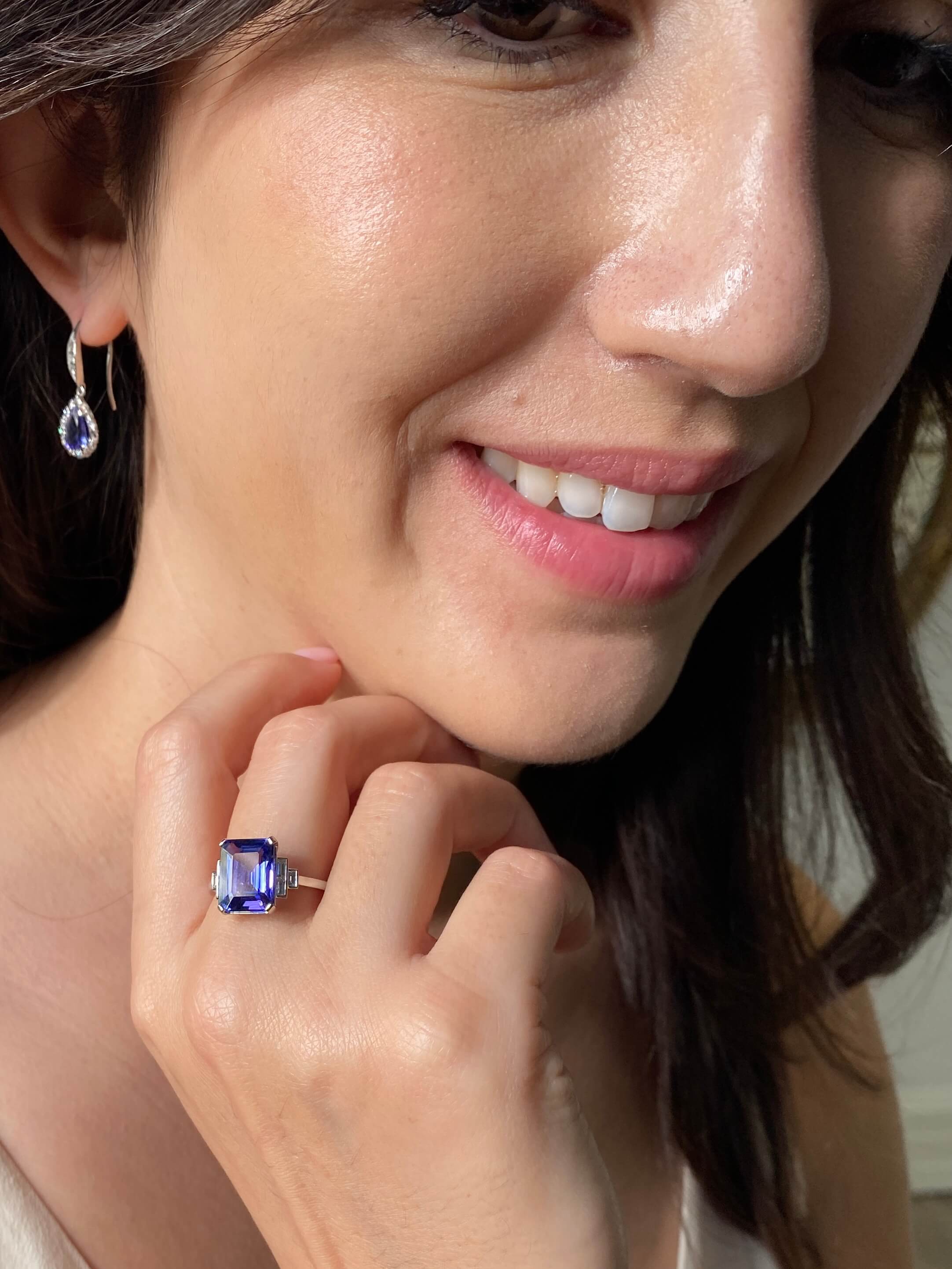 Art Deco Style Tanzanite and Diamond Ring. An elegant ring set with an 4.54 carat emerald-cut tanzanite and baguette-cut diamonds. Platinum.