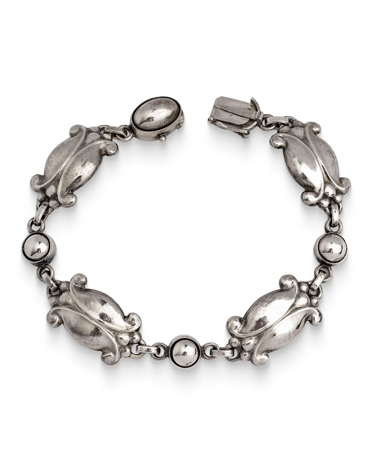 Authentic Georg Jensen, Silver Moonlight Blossom Bracelet, No. 11. An articulated bracelet  designed in the 1940's by Georg Jensen, featuring stylised tulip motifs.