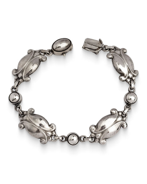 Authentic Georg Jensen, Silver Moonlight Blossom Bracelet, No. 11. An articulated bracelet  designed in the 1940's by Georg Jensen, featuring stylised tulip motifs.
