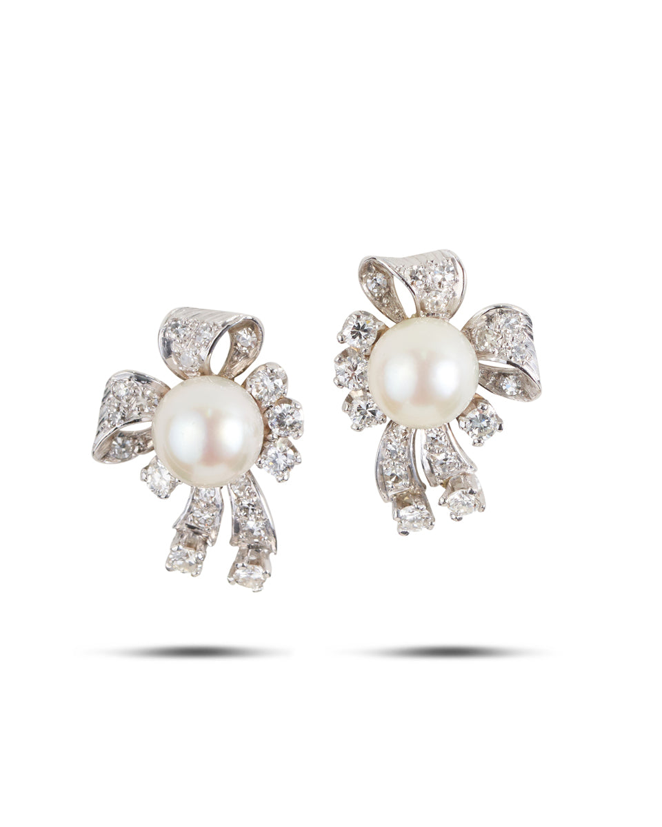 An elegant pair of 18ct white gold Diamond and Pearl Earrings from the 1950's.