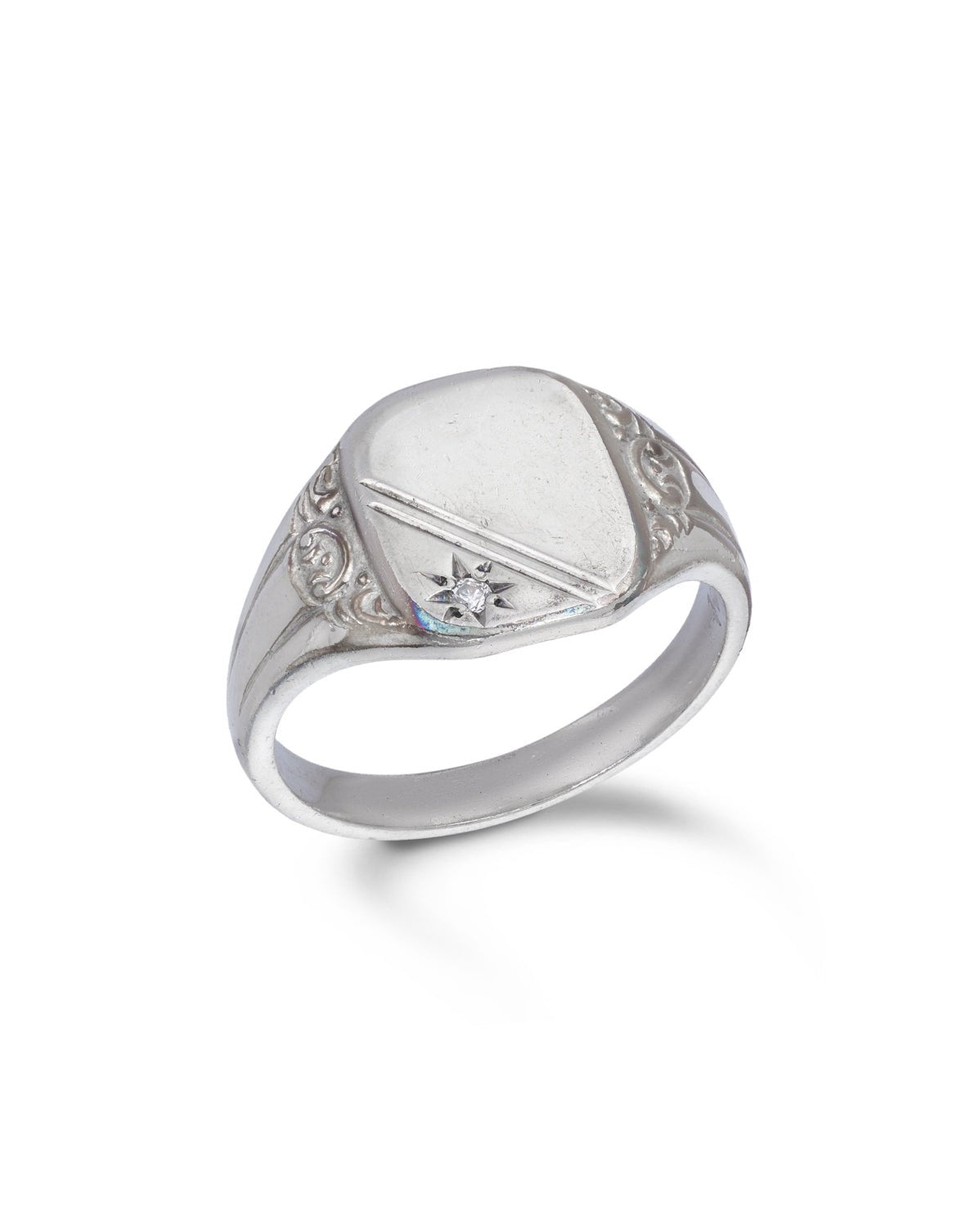 Vintage Silver Signet Ring. A classic signet ring set with a modern round brilliant cut diamond of estimated weight 0.03 carat.

