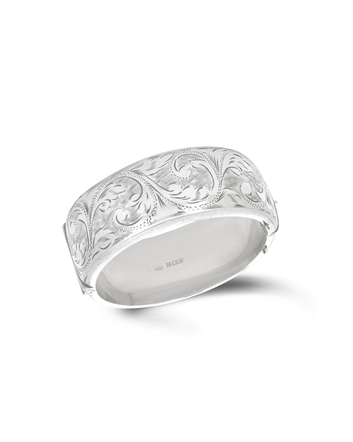 Vintage English Sterling Silver Bangle, c1970. The hinged bangle with all over engraved foliate decoration