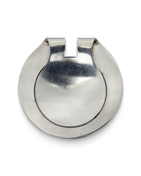 Georg Jensen, Sterling Silver Money Clip No. 369. Hand-formed from a single sheet of silver into a rounded, horseshoe-shaped clip with a narrow slotted opening at the top, the rolled edges curling inward to hold banknotes securely. 
