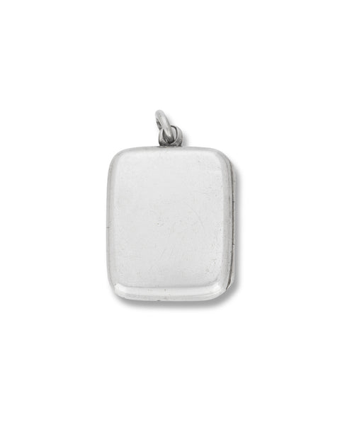 Antique Silver Locket, of rectangular plain and polished design, opening to reveal locket compartments containing photos.