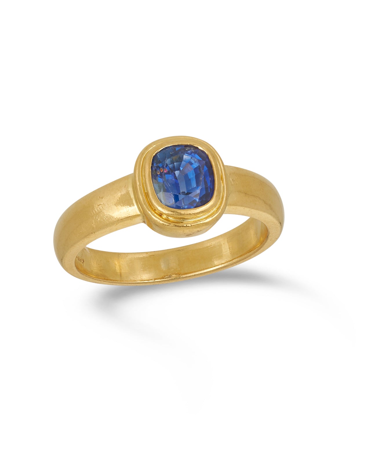 Contemporary bezel set gold & sapphire ring